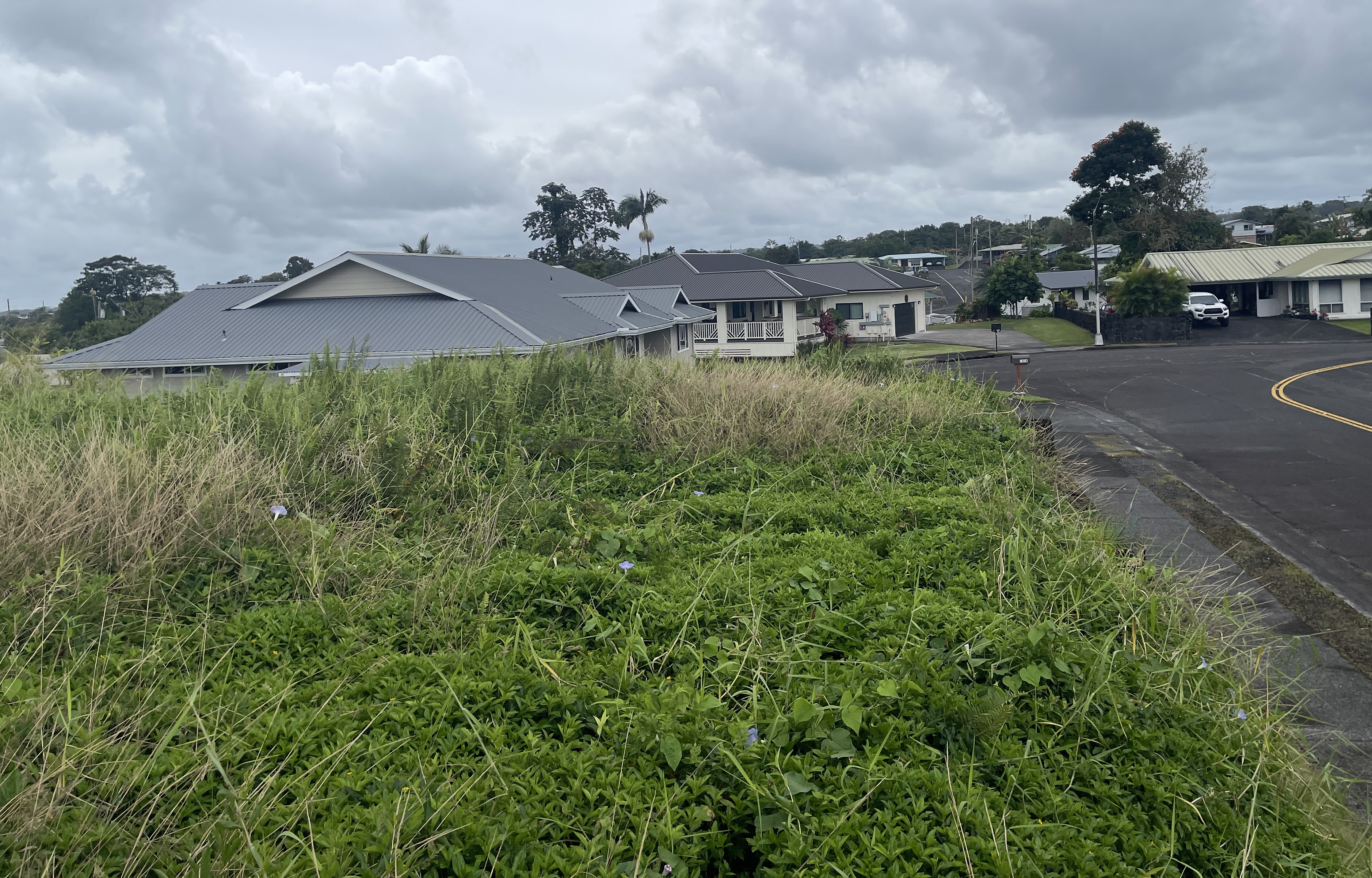 6 Lot Hilo, HI 96720 - Photo 11 of 18 an aerial view of a house with a yard table and chairs