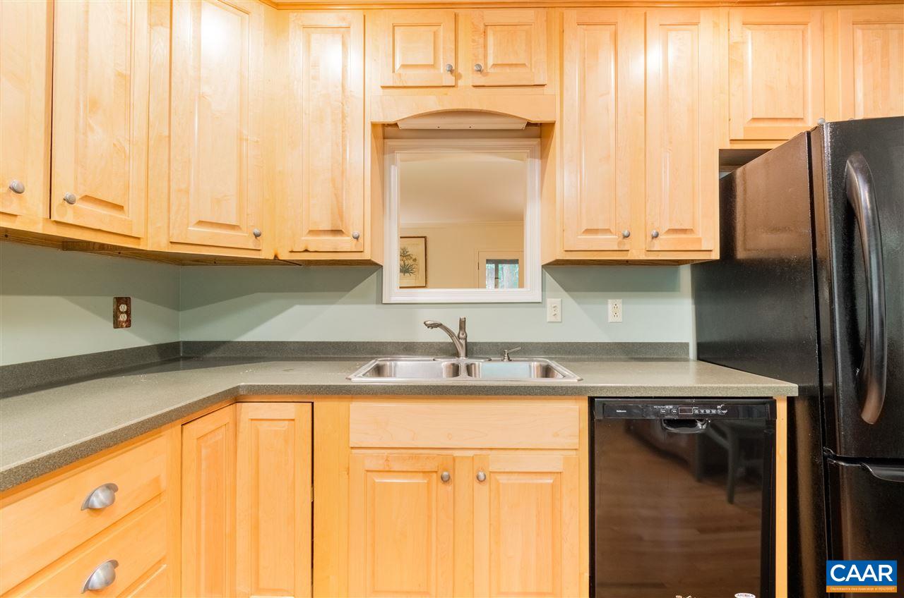 118 Chestnut Ridge Road Charlottesville, VA 22911 - Photo 15 of 35 a kitchen with stainless steel appliances granite countertop a sink and a refrigerator