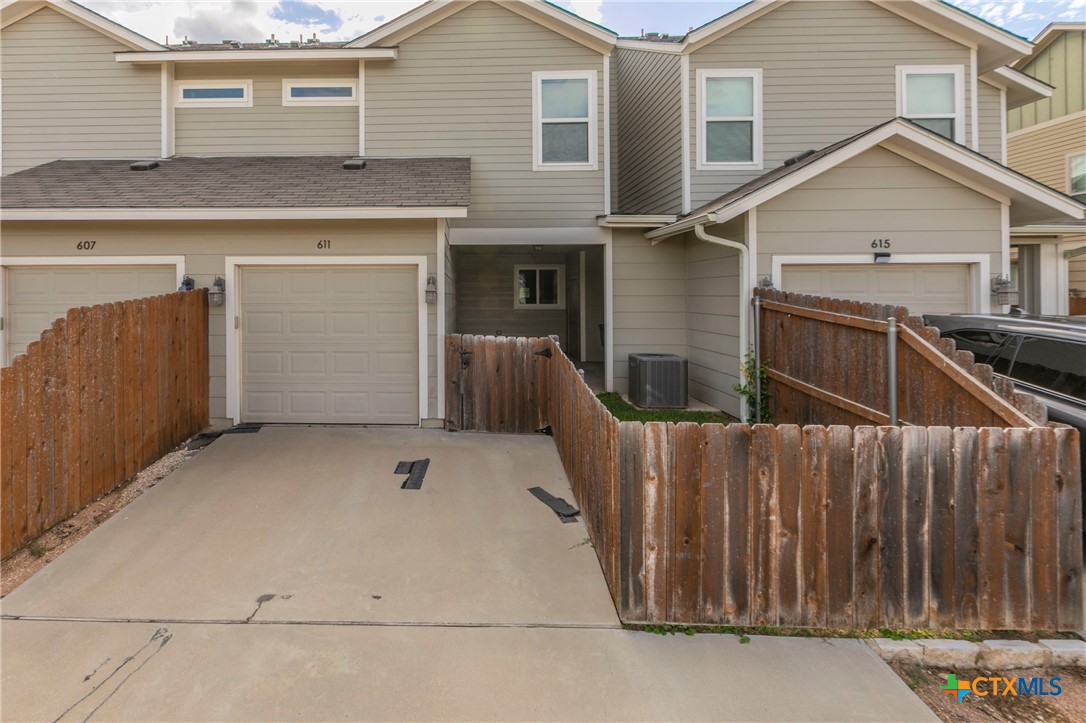 611 Westfield Boulevard Temple, TX 76502 - Photo 16 of 17 a front view of a house with garage