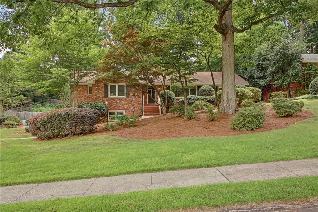 1693 Alderbrook Road Northeast Atlanta, GA 30345 - Photo 1 of 1 a view of a house with a backyard