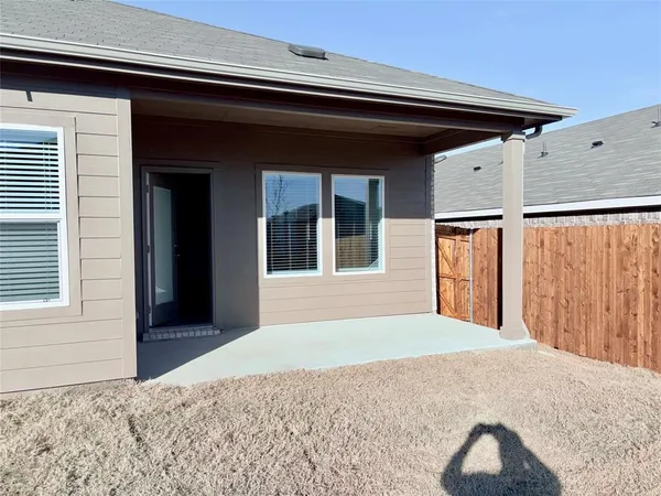 a view of a backyard of the house