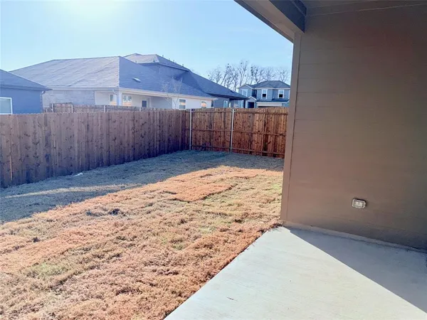 a view of a backyard of the house