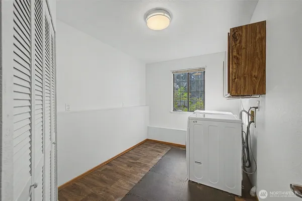 a bathroom with a sink and a window