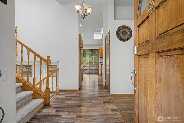 a view of an entryway with wooden floor