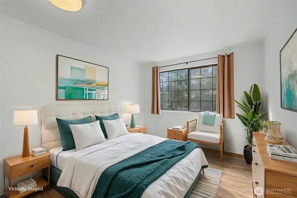 a bedroom with a bed and a window
