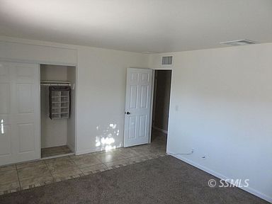 219 Larkspur Street Ridgecrest, CA 93555 - Photo 22 of 34 a view of room with walk in closet and window