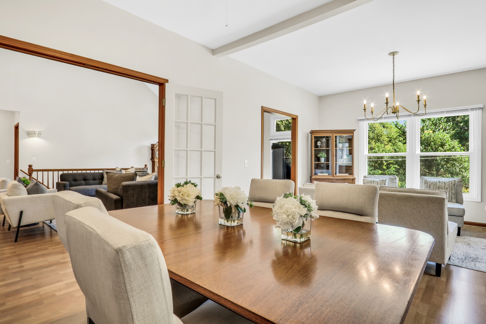 1075 Suffolk Court Gurnee, IL 60031 - Photo 17 of 51 a dining room with furniture a large window and a chandelier