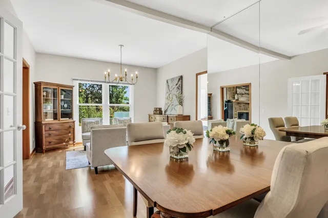 a large living room with dining table furniture