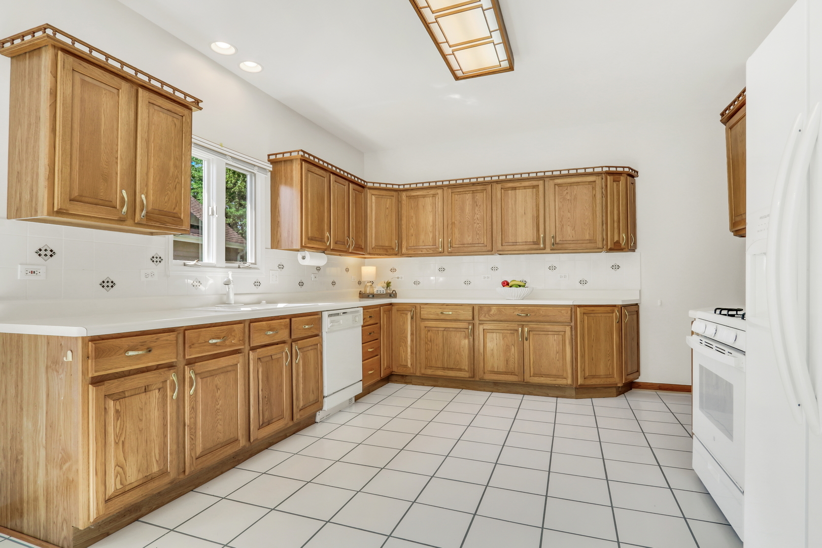 1075 Suffolk Court Gurnee, IL 60031 - Photo 22 of 51 a kitchen with stainless steel appliances a stove sink and cabinets
