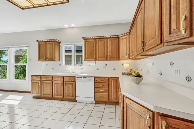 a kitchen with stainless steel appliances granite countertop a sink and cabinets