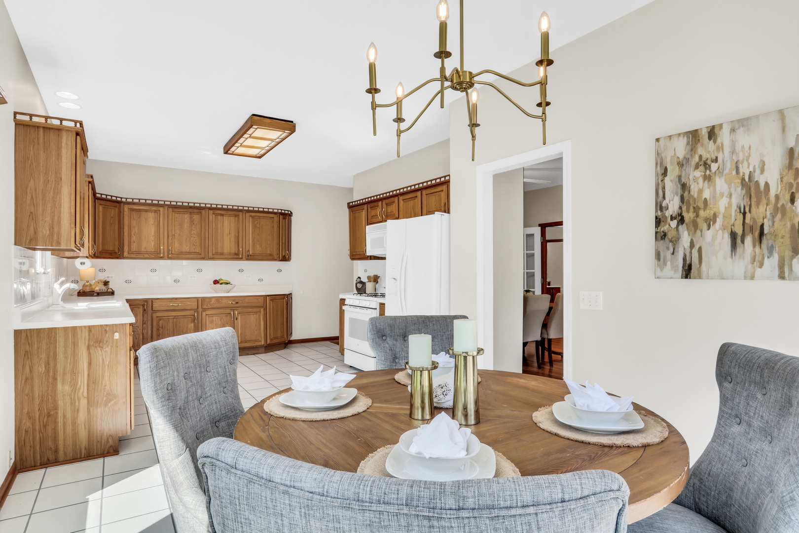 1075 Suffolk Court Gurnee, IL 60031 - Photo 27 of 51 a dining room with furniture a kitchen view and wooden floor