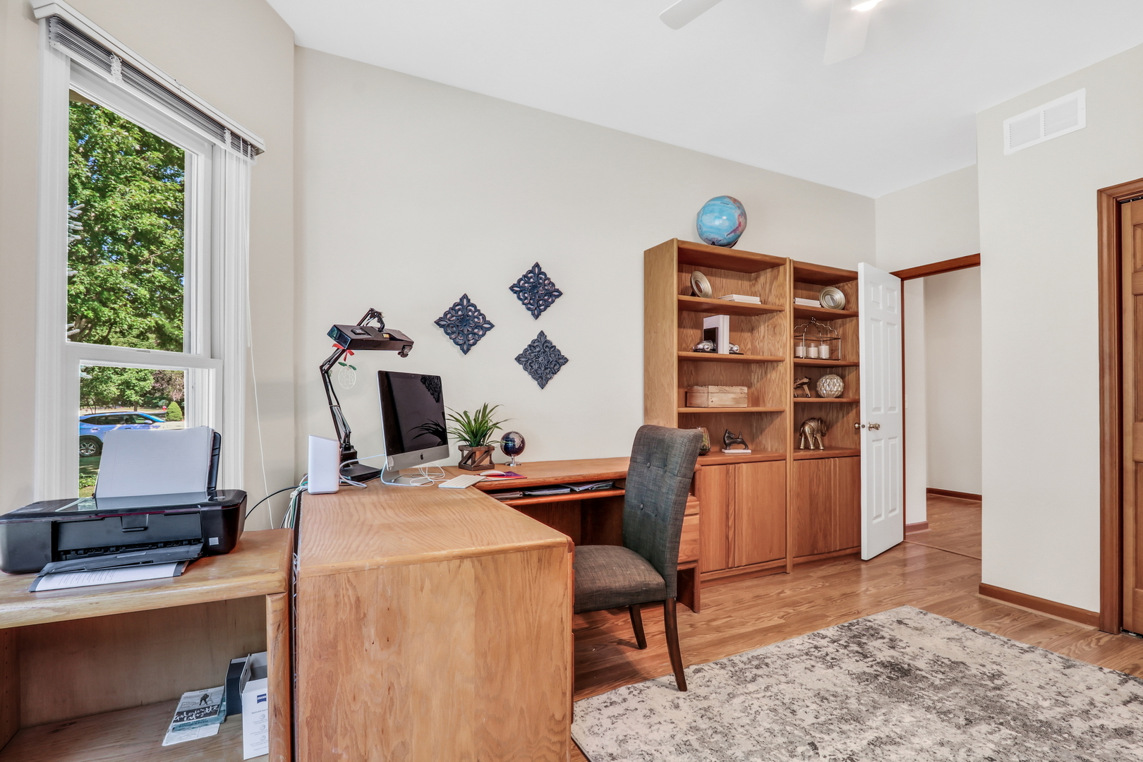 1075 Suffolk Court Gurnee, IL 60031 - Photo 35 of 51 a view of a workspace with furniture and a window