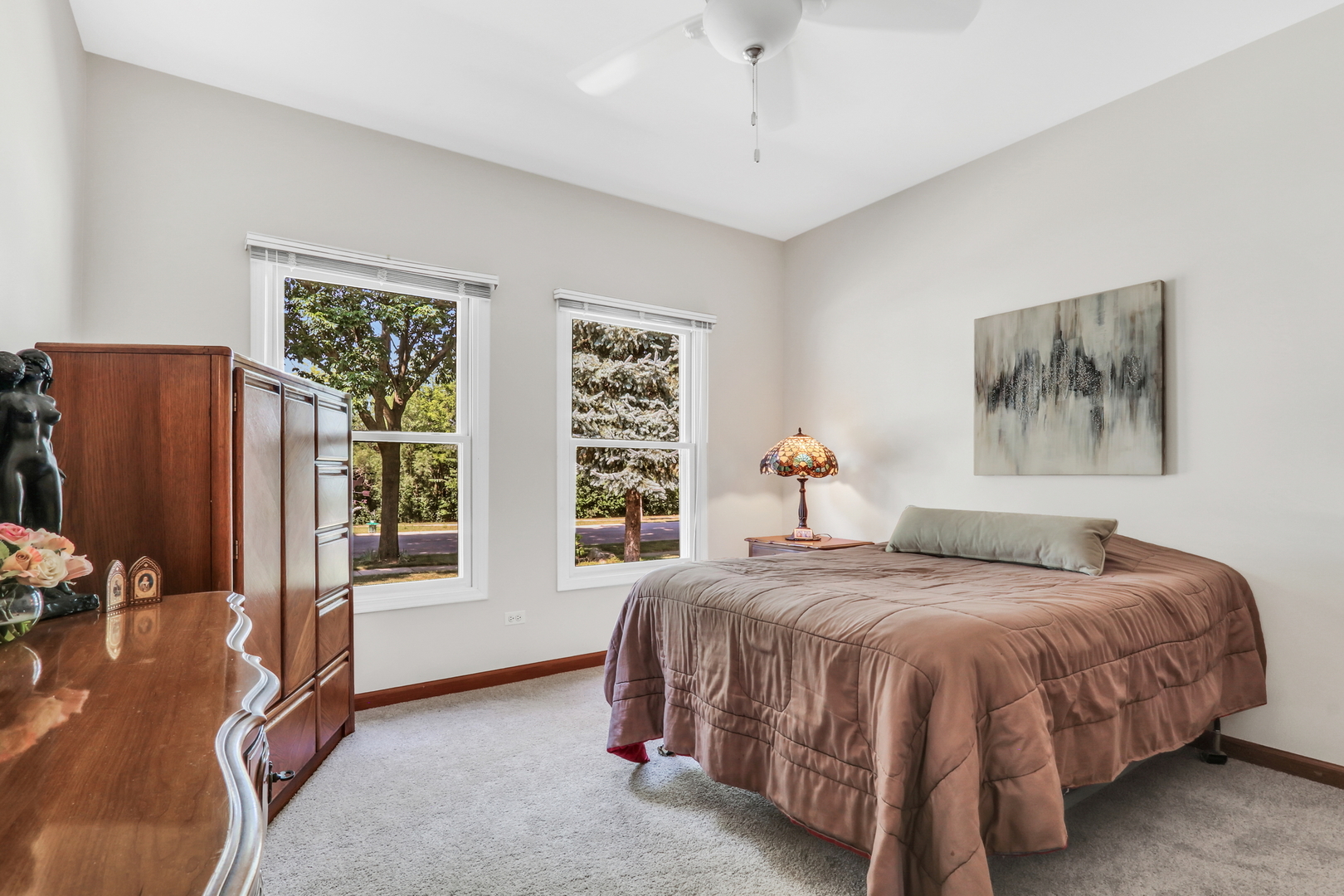 1075 Suffolk Court Gurnee, IL 60031 - Photo 36 of 51 a bedroom with a large bed and a window