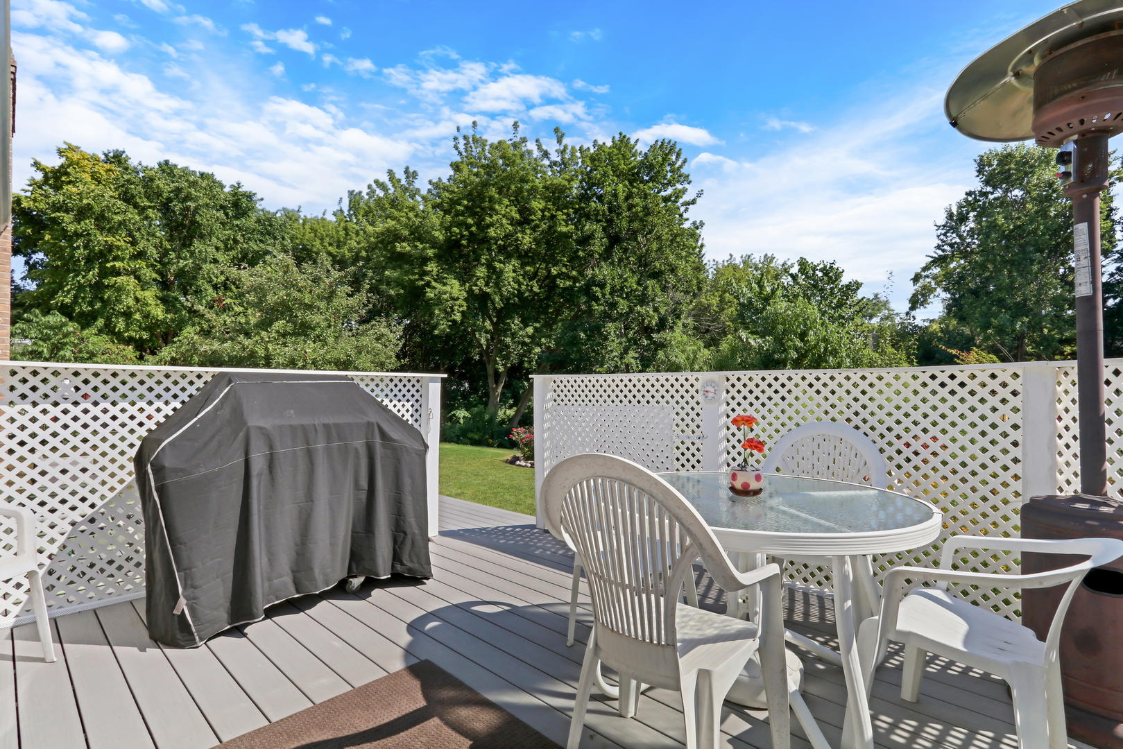 1075 Suffolk Court Gurnee, IL 60031 - Photo 43 of 51 a view of a patio with table and chairs with wooden floor and fence
