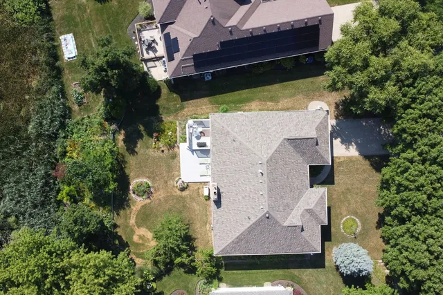 an aerial view of a house with a garden