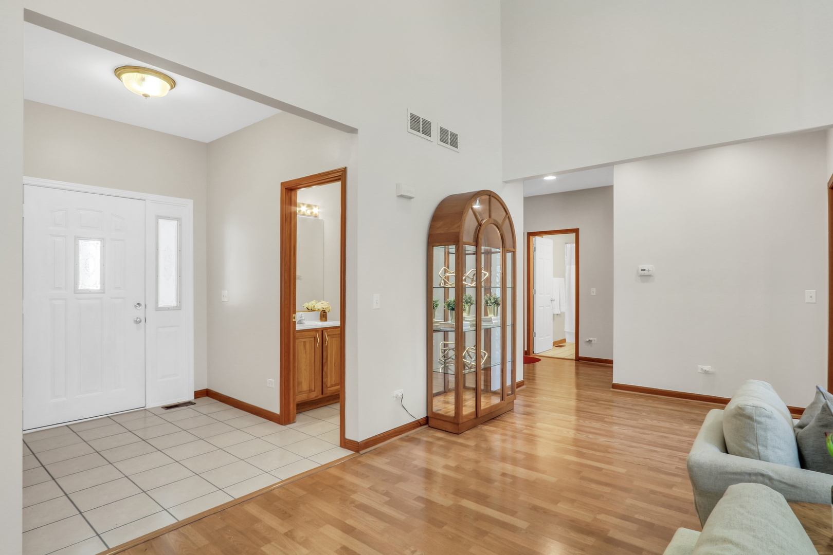 1075 Suffolk Court Gurnee, IL 60031 - Photo 10 of 51 a view of empty room with wooden floor and fan