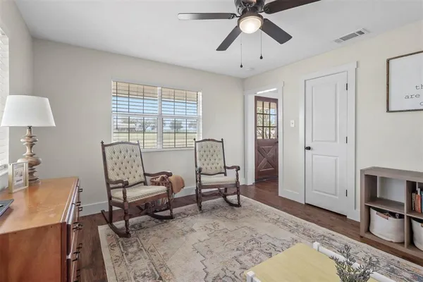 a living room with furniture and a window