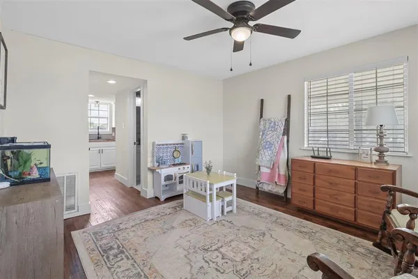 a bed room with furniture and a window