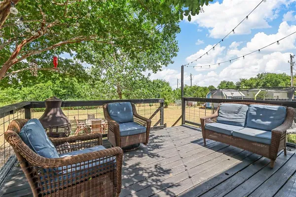 a view of a house with a yard and a pond