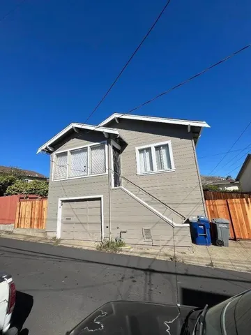 a front view of a house with roof deck
