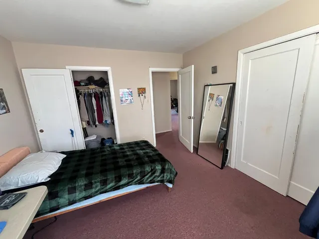a room with closet and a couch