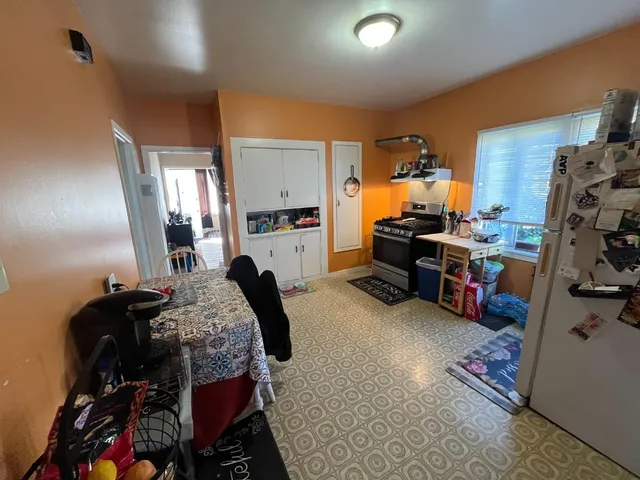 a bed room with a bed and a chair