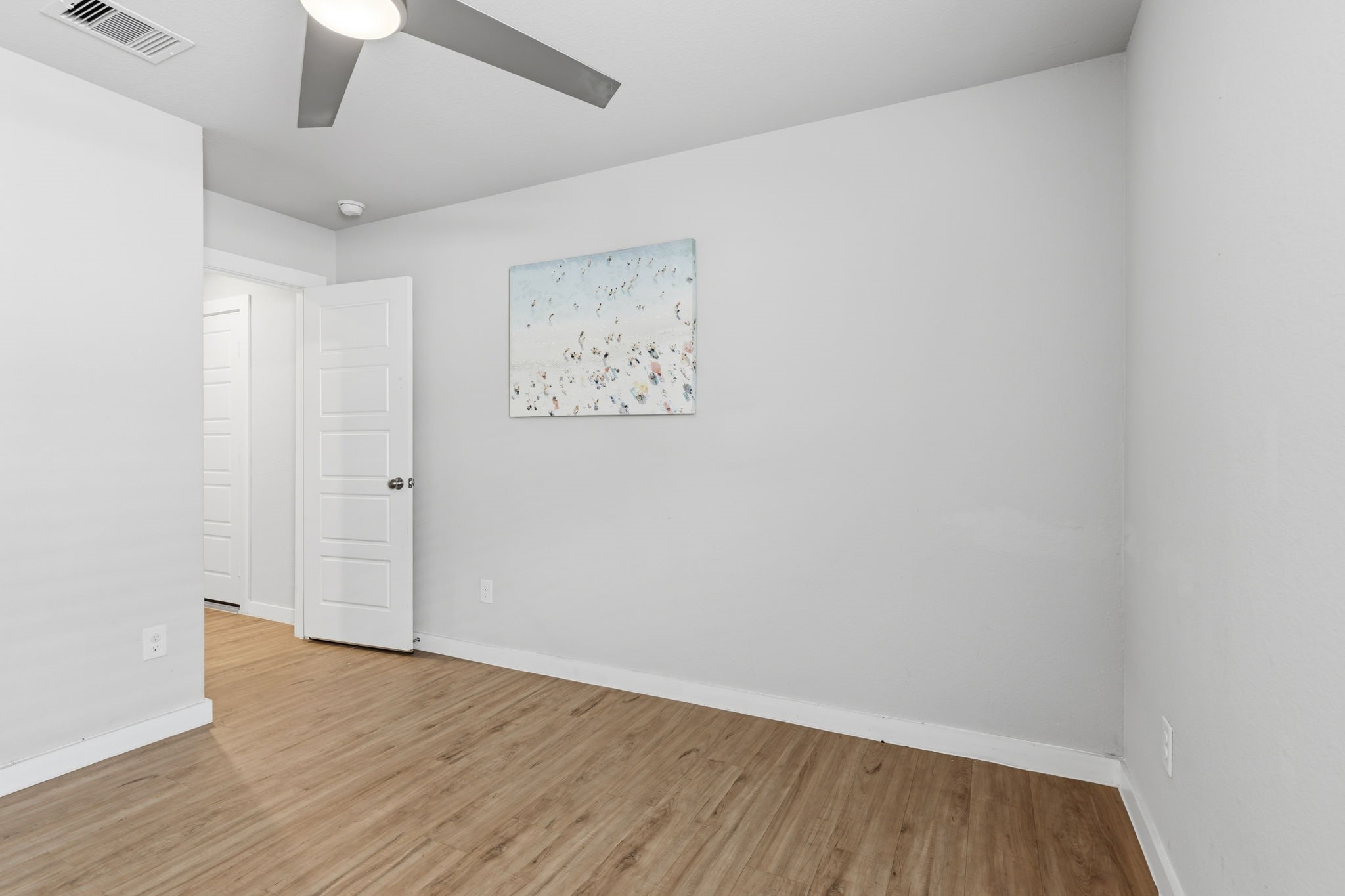14914 Big Bend Ranch Drive Cypress, TX 77433 - Photo 38 of 49 an empty room with wooden floor and ceiling fan