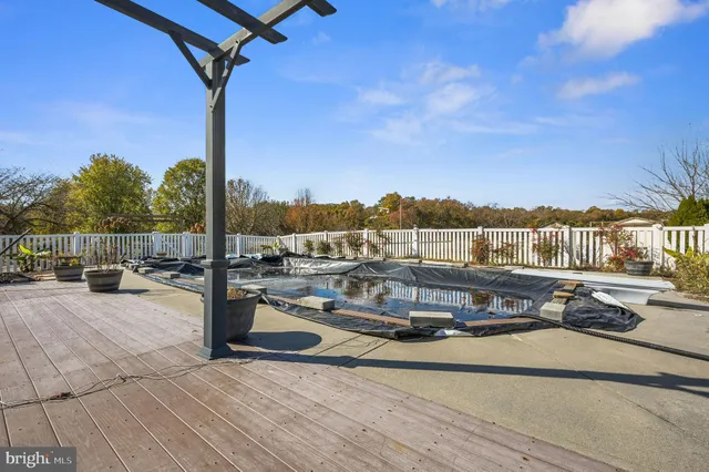 a view of a ocean with a table and chairs
