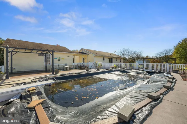 a view of a swimming pool with lounge chairs