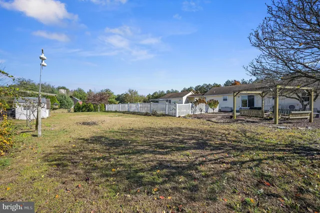 a house view with swimming pool in front of it