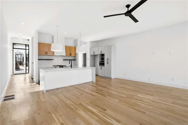 a view of a kitchen with microwave and cabinets