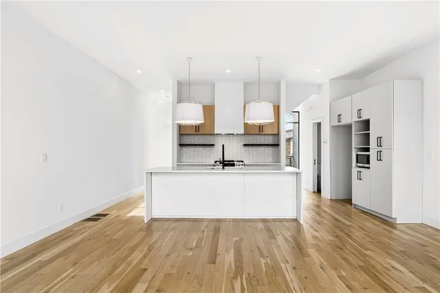 a view of kitchen with wooden floor