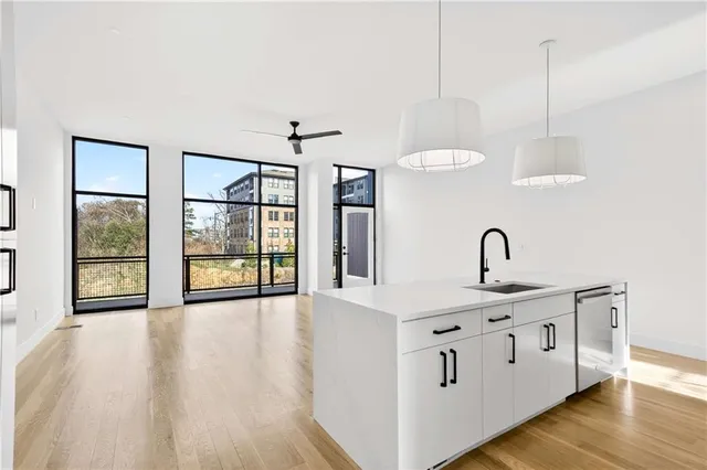 a hallway with sink and mirror