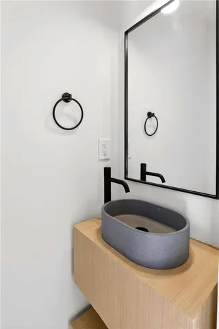 a bathroom with a sink and a mirror