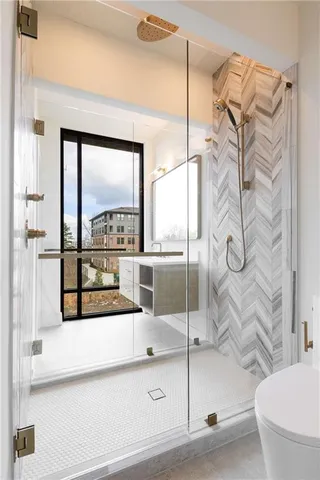 a bathroom with a tub and shower