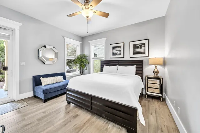 a bedroom with a bed and a chandelier