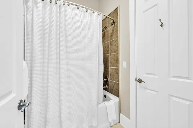 a bathroom with a shower and a tub