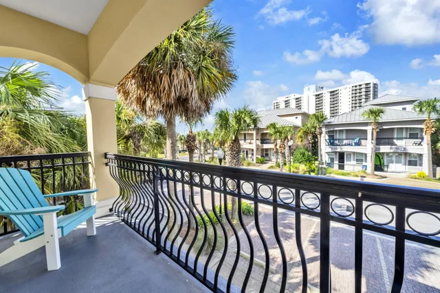 a bathroom with a granite countertop sink toilet mirror and shower