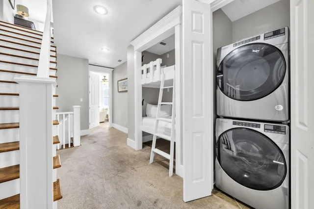 a bedroom with a bed couch and window