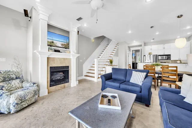 a living room with furniture and a fireplace