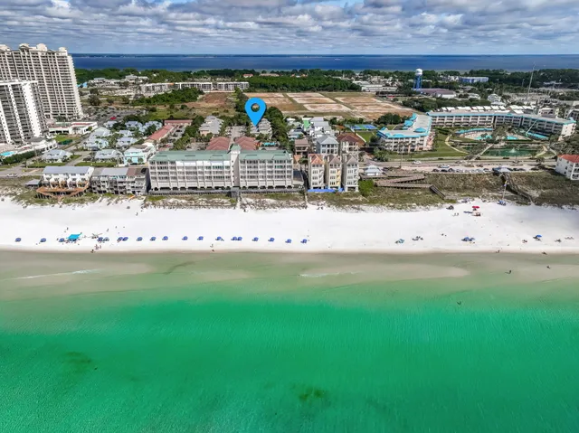 a view of a building with garden and plants