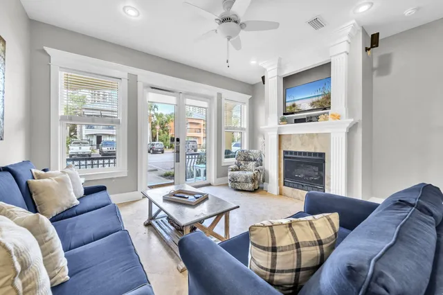 a living room with furniture fireplace and a flat screen tv