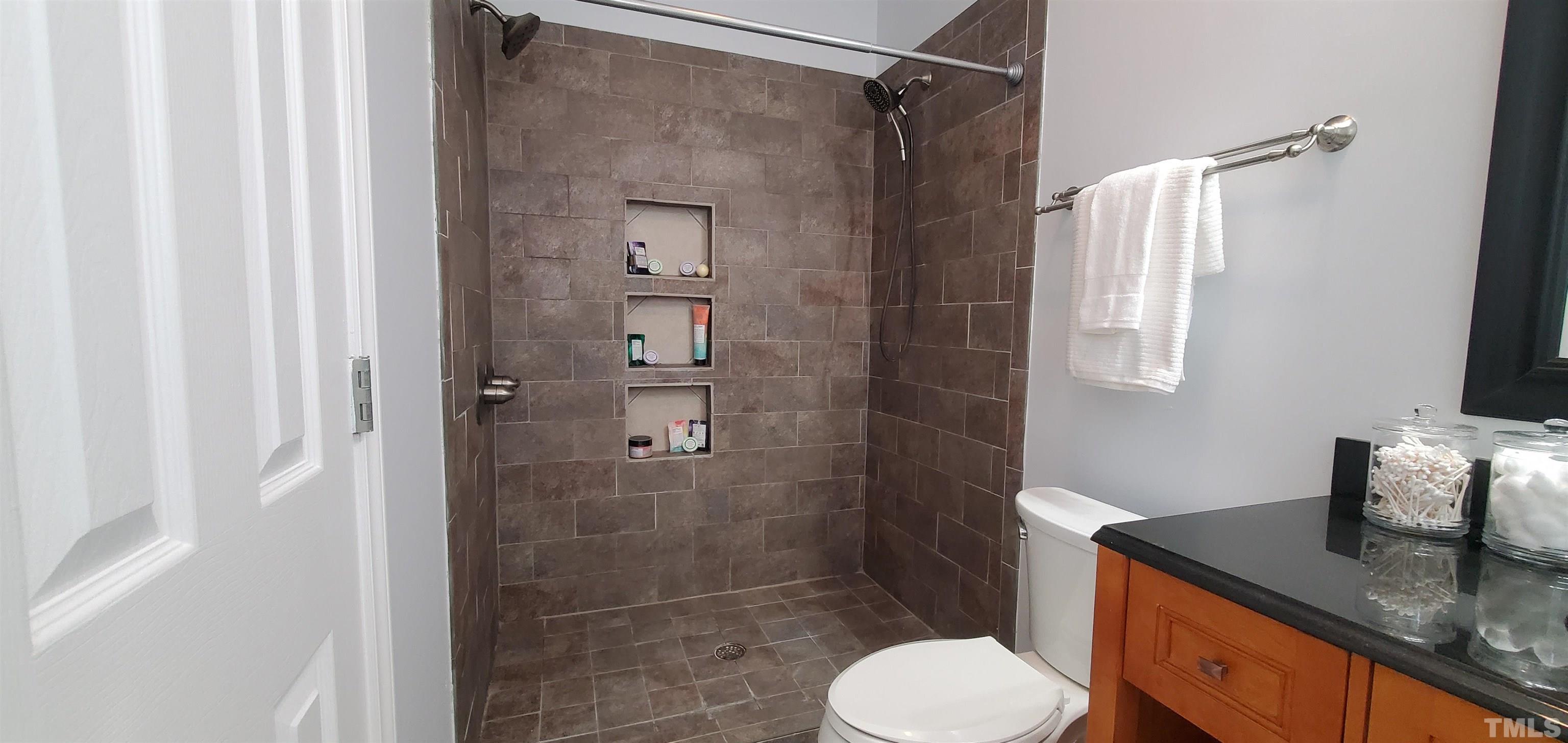 1917 Barngate Way Raleigh, NC 27614 - Photo 5 of 10 a bathroom with a granite countertop sink toilet and shower