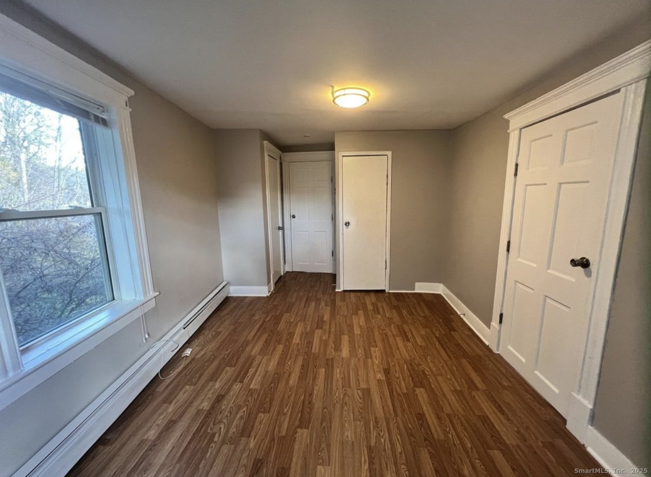 68 Anderson Street, Unit 3R Naugatuck, CT 06770 - Photo 1 of 1 a view of a room with wooden floor and window