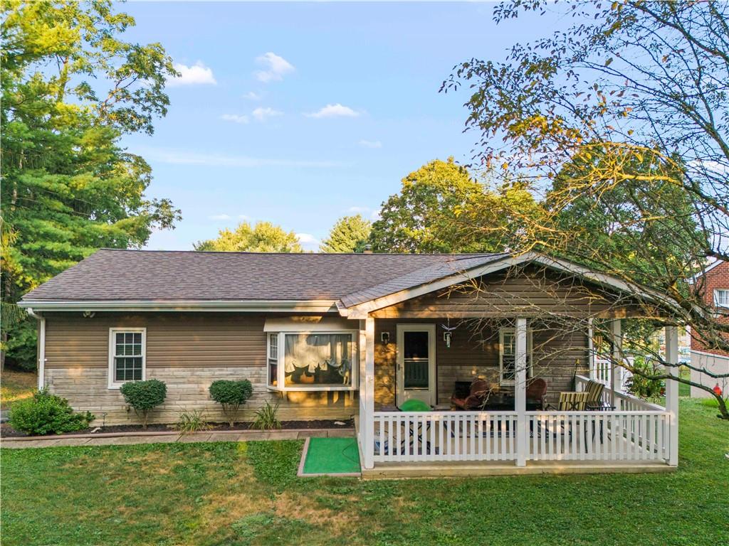 412 Center Church Road Canonsburg, PA 15317 - Photo 1 of 24 a view of a brick house with a yard plants and large tree