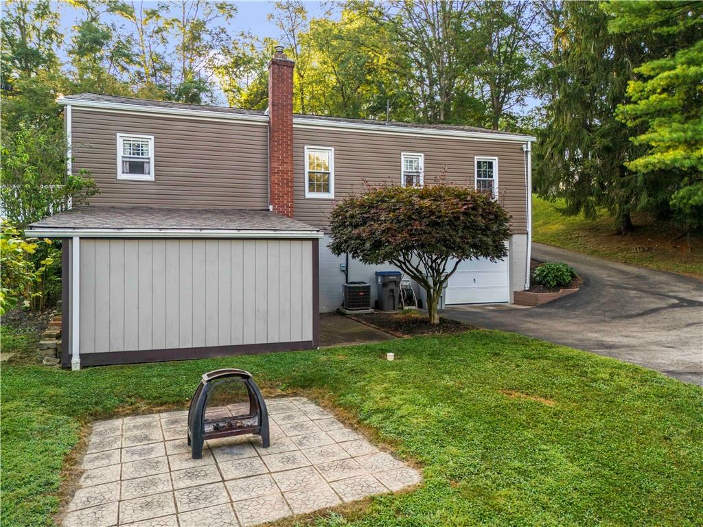 412 Center Church Road Canonsburg, PA 15317 - Photo 21 of 24 a view of a house with backyard and a tree