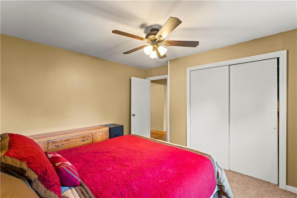 412 Center Church Road Canonsburg, PA 15317 - Photo 9 of 24 a bedroom with a bed and a chandelier