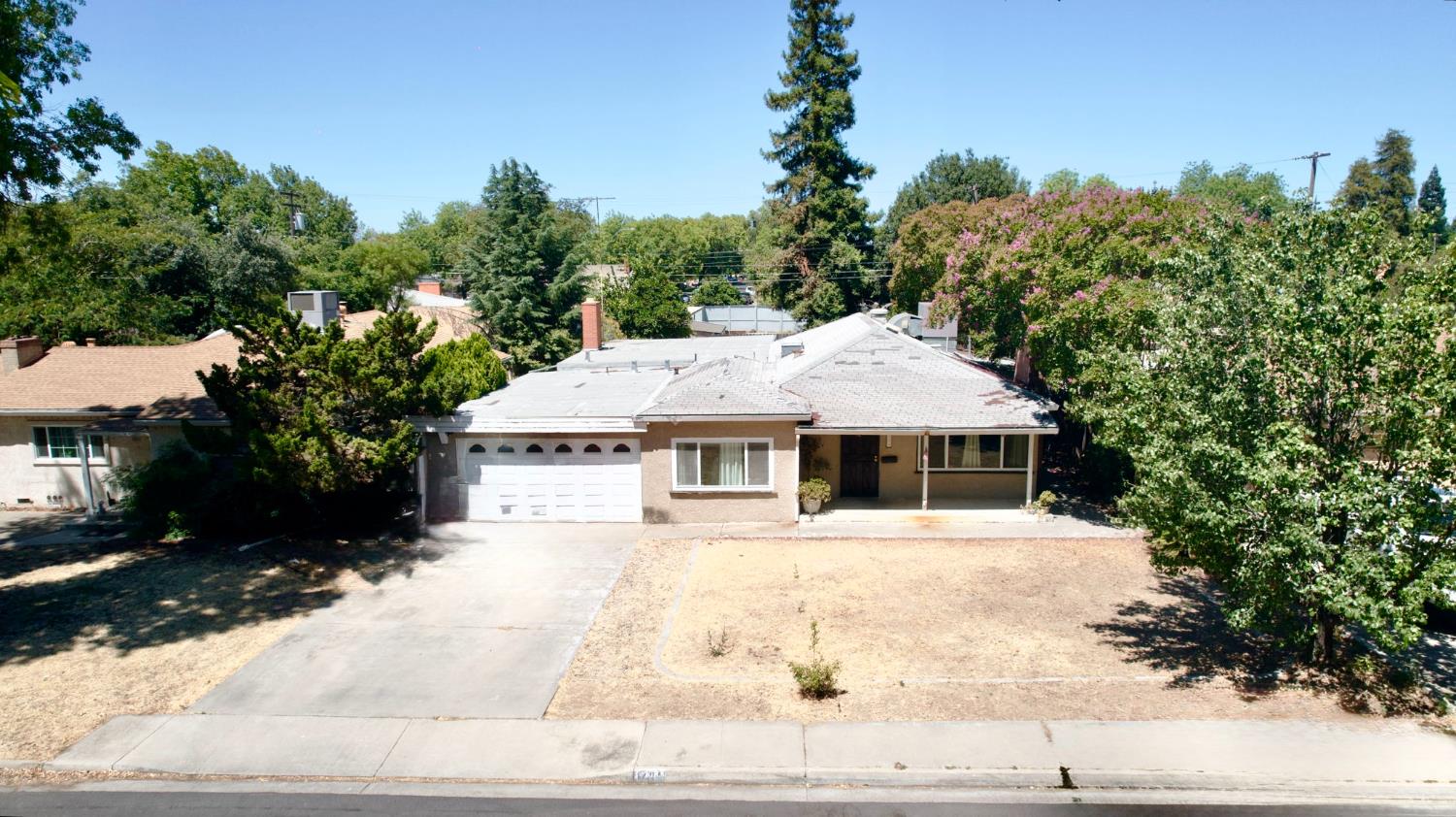 1705 Stetson Avenue Modesto, CA 95350 - Photo 32 of 32 a view of a white house with a outdoor space