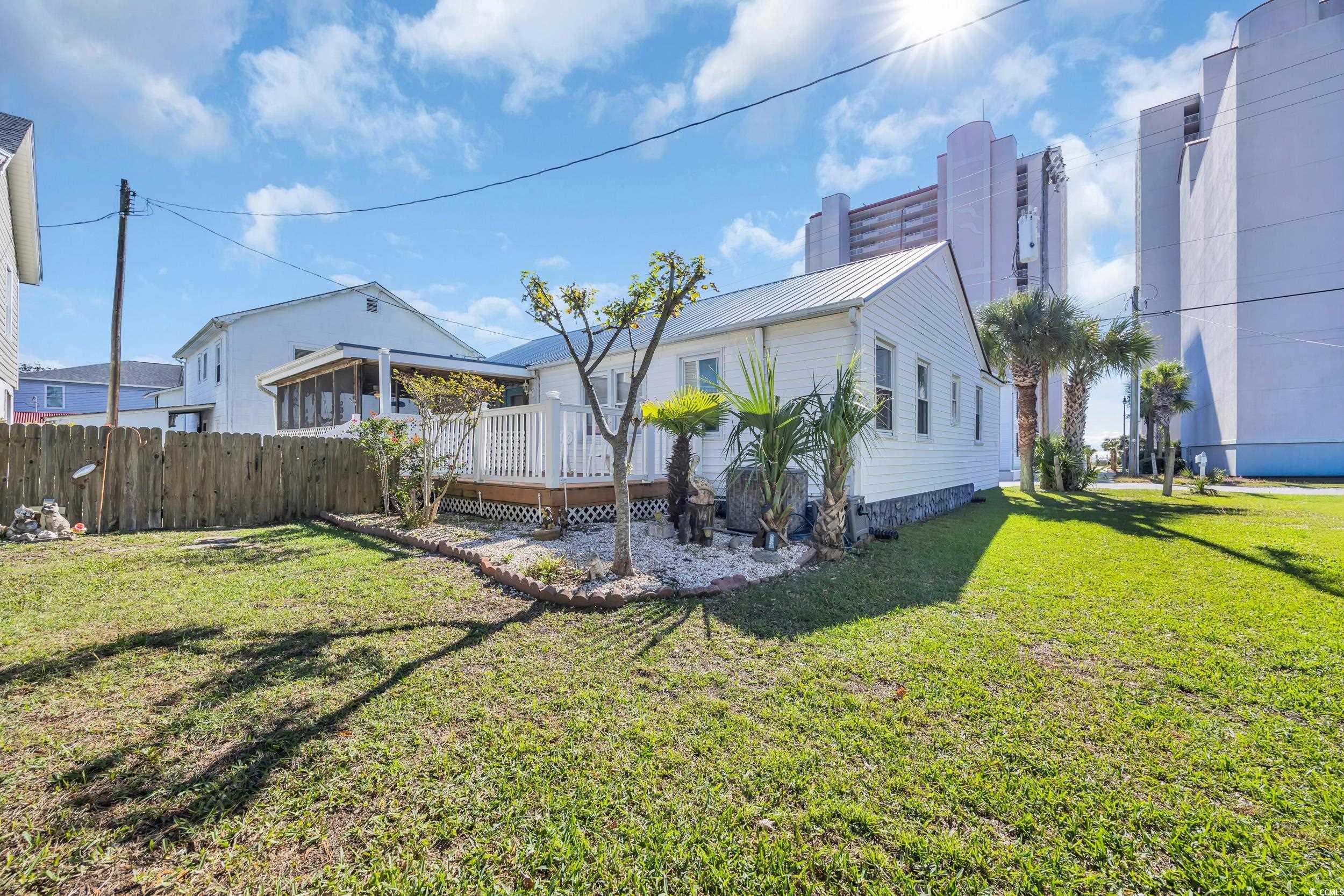 1616 Perrin Drive North Myrtle Beach, SC 29582 - Photo 24 of 40 View of home's exterior with a yard and a wooden deck