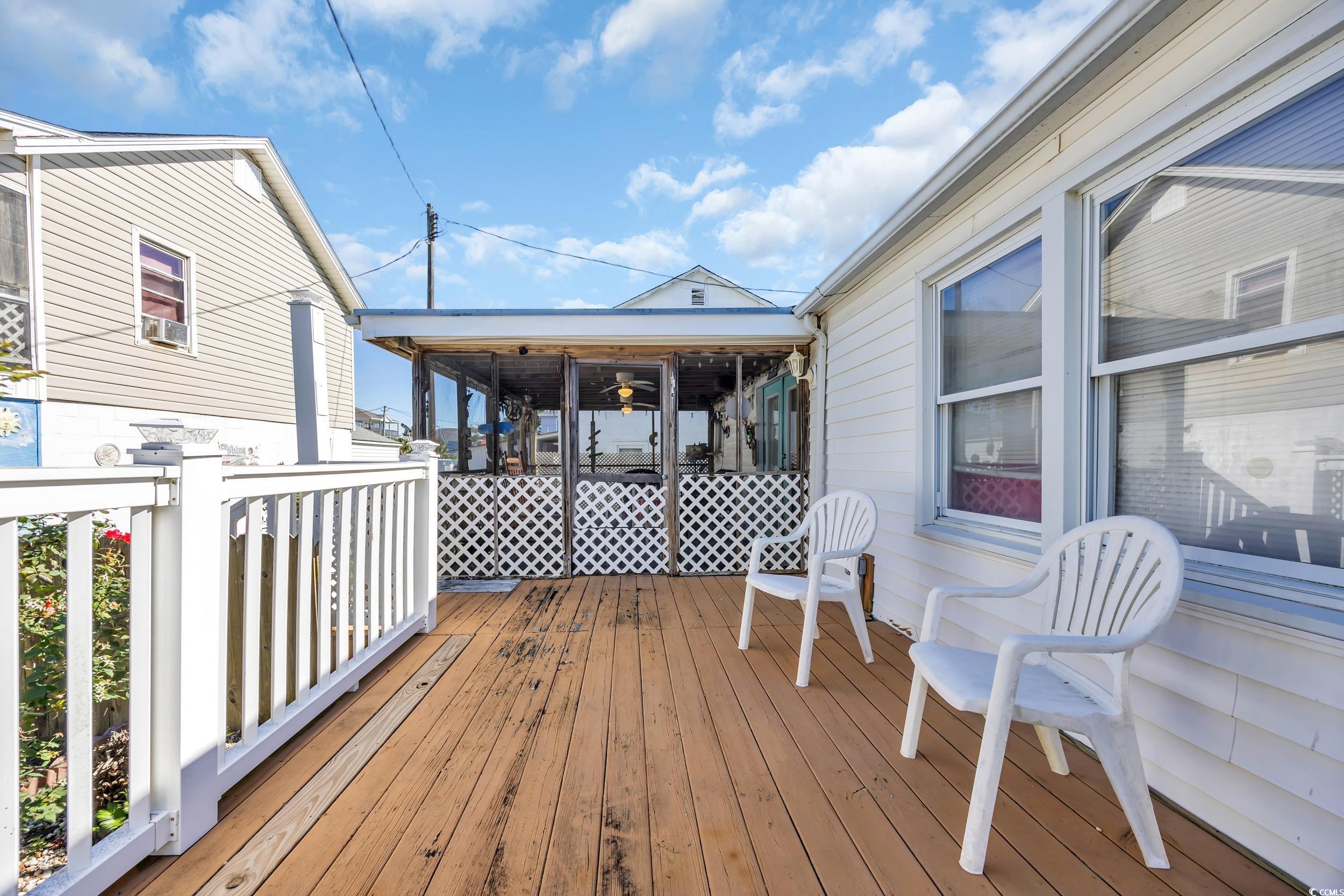 1616 Perrin Drive North Myrtle Beach, SC 29582 - Photo 25 of 40 Wooden terrace featuring ceiling fan and a sunroom